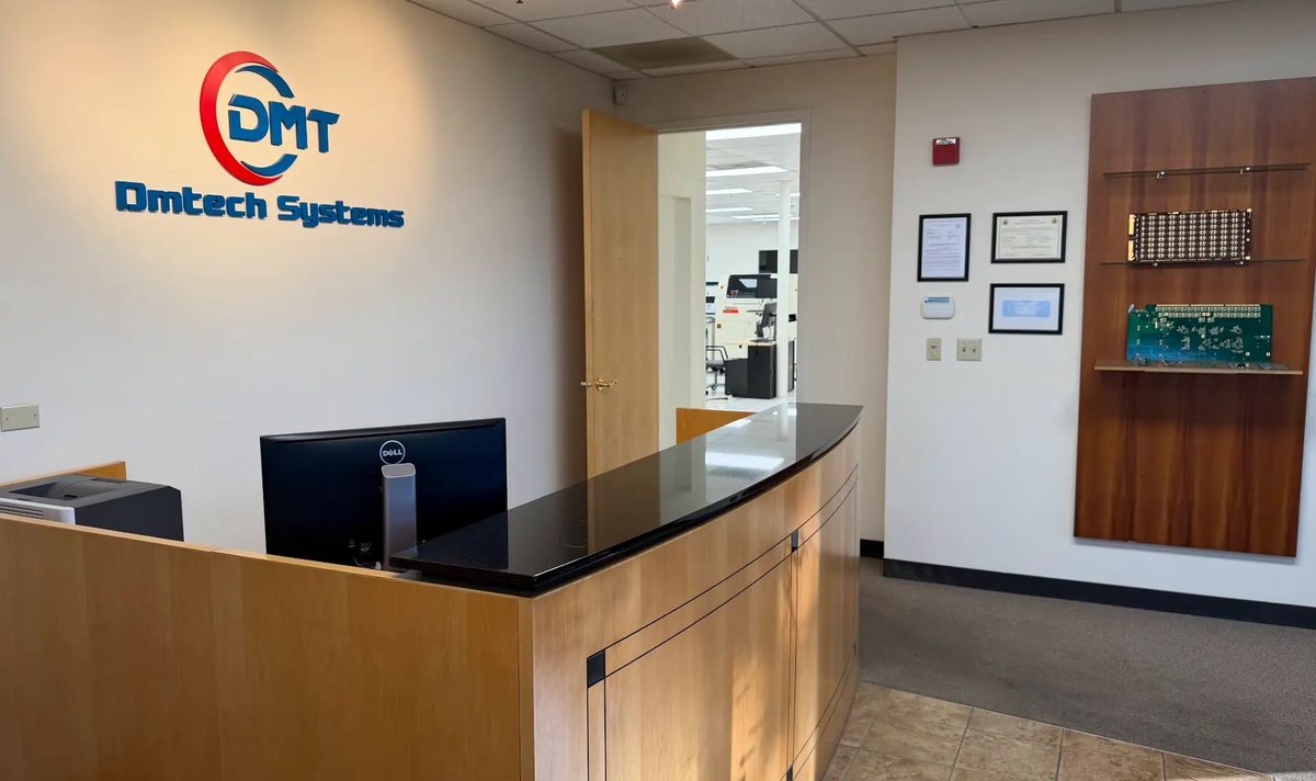 DMTech Systems reception in Milpitas, California, with the production floor visible beyond